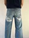 BACK TORN JEANS